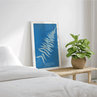 Botanical cyanotype artwork Woodwardia virginica by Anna Atkins Poster of Woodwardia virginica by Anna Atkins displaying a cyanotype of a fern leaf against a blue background.