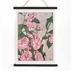 Prairie Rose by Hannah Borger Overbeck depicts vibrant pink flowers with green leaves. Poster of pink and white prairie roses with green leaves by Hannah Borger Overbeck titled Prairie Rose.
