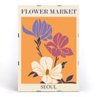 Flower Market - Seoul 2 by Moryarty featuring colorful illustrated flowers Poster featuring three stylized flowers on an orange background with text Flower Market Seoul titled Seoul 2 by Moryarty