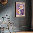 Illustration of yellow and white flowers by the artist Moryarty titled Flower Market - Cardiff Poster titled Flower Market - Cardiff by Moryarty featuring illustrated daffodils on a purple background.