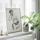 Nude female figure seated reading by Kenion Cox titled Nude Study 1896 Poster of Nude Study by Kenion Cox featuring a pencil sketch of a seated nude woman reading a book with a contemplative expression.