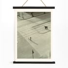 Cyclist on an empty street at dawn captured in artwork 7 AM New Years Morning by László Moholy-Nagy Poster of a black and white city street scene with a cyclist by László Moholy-Nagy titled 7 A.M. New Year’s Morning