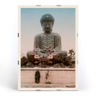 Large Buddha by Kinbei Kusakabe featuring a serene statue with two people standing in front. Poster of Large Buddha with two people in front by artist Kinbei Kusakabe featuring a serene statue surrounded by flowers.