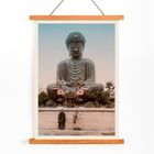 Large Buddha by Kinbei Kusakabe featuring a serene statue with two people standing in front. Poster of Large Buddha with two people in front by artist Kinbei Kusakabe featuring a serene statue surrounded by flowers.