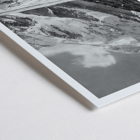 Black and white photograph of Broad Peak by Vittorio Sella featuring snow-covered mountains and climbers in the foreground Poster of snowy Broad Peak mountain captured by Vittorio Sella with mountaineers climbing amidst rocky terrain and glacier