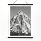 Mount Paitju towering with snow and rugged terrain photo by Vittorio Sella. Poster of Le mont Paitju, vue prise du Baltoro by Vittorio Sella showing a towering snow-covered mountain.