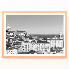 Lisbon Old City landscape black and white by Picture 2 featuring historic architecture and distant sea view Poster featuring a black and white landscape of Lisbon's old city with rooftops and historic buildings titled Lisbon Old City Landscape
