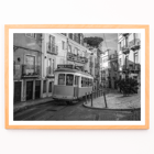 Lisbon Tramway 28 by Black & White Picture showing historic tram in Lisbon street scene Poster featuring Lisbon Tramway 28 Black & White Picture showing the tram navigating through narrow, historic streets with cobblestone pathways.