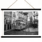 Lisbon Tramway 28 by Black & White Picture showing historic tram in Lisbon street scene Poster featuring Lisbon Tramway 28 Black & White Picture showing the tram navigating through narrow, historic streets with cobblestone pathways.