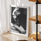 Before going to bed by Michael Heumuller depicts a person gracefully removing a garment Poster of a person removing a shirt in a dimly lit room titled Before going to bed by Michael Heumuller.