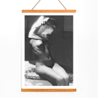Before going to bed by Michael Heumuller depicts a person gracefully removing a garment Poster of a person removing a shirt in a dimly lit room titled Before going to bed by Michael Heumuller.