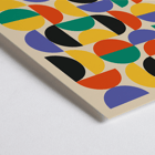 Colorful geometric shapes in Bauhaus Poster 11 inspired by the Weimar Exhibition. Bauhaus Poster 11 features colorful geometric shapes in a grid pattern inspired by the Weimar Exhibition artwork.
