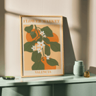 Illustration of flowers and green leaves on an orange background Flower Market Valencia by Moryarty Poster of Flower Market Valencia by Moryarty featuring green leaves and white flowers with orange background elements.