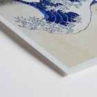 The Great Wave off Kanagawa by Katsushika Hokusai features a dramatic large wave towering over small boats. The Great Wave off Kanagawa poster by Katsushika Hokusai depicting a large wave threatening boats with Mount Fuji in the background.