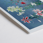 Lily hand-colored collotype from Some Japanese Flowers by Kazumasa Ogawa featuring colorful lilies on a blue background Poster of vibrant lilies in various colors by Kazumasa Ogawa from Some Japanese Flowers.
