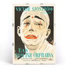 Vintage movie poster of He Who Gets Slapped by Eric Rohman featuring a clown face with red makeup. Poster of He Who Gets Slapped by Eric Rohman featuring a sad clown face with dramatic makeup and bold text in Swedish.