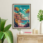 Colorful coastal landscape with palm trees from the artwork Morocco Travel Poster by the artist. Morocco Travel Poster featuring a vibrant coastal landscape with palm trees and a Mediterranean style building by the sea
