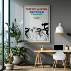 Cyclists racing illustration by Karlis Smiltens titled Redlands bicycle classic Poster of cyclists in race with title Redlands Bicycle Classic by Karlis Smiltens in red, blue, and green text on a white background.