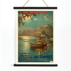 Lac d’Annecy by François-Charles Cachoud featuring a boat on a serene lake with mountains in the background Poster featuring a serene evening scene of a boat on Lac d'Annecy with surrounding mountains and a glowing sky by François-Charles Cachoud.