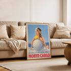 Artwork by Louis Icart titled Monte Carlo featuring two women in swimsuits sitting on a large ball. Poster showing two women seated on a large ball at the beach with text Monte Carlo by Louis Icart.