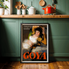The Clothed Maja exhibition poster by Francisco Goya featuring a reclining woman in a white dress with yellow sleeves The Clothed Maja exhibition poster by Francisco Goya at Fondation Beyeler featuring the reclining woman in white and gold attire