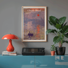 Claude Monet Soleil Levan exhibition poster Impressionist artwork scene Claude Monet exhibition poster titled Soleil Levan featuring a vibrant impressionist scene with a red sun over water.