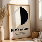 Exhibition poster titled Buddha's Standpoint in the Earthly Life by artist Hilma Af Klint featuring abstract black and white circle design. Exhibition poster with abstract artwork Buddha's Standpoint in the Earthly Life by Hilma Af Klint featuring a circle design.