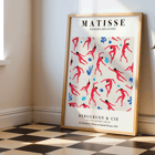 Matisse Dancing Figures Exhibition Poster featuring red cut-out figures on a patterned background with exhibition details.