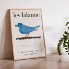 Exhibition poster featuring a blue bird by François-Xavier Lalanne for Les Lalanne Exhibition Les Lalanne Exhibition Poster by François-Xavier Lalanne featuring a stylized blue bird with orange legs on beige background