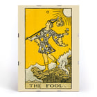 The Fool tarot card illustration by Lauron William de Laurence featuring a whimsical character and a small dog on a cliff. The Fool tarot card poster by Lauron William de Laurence depicts a figure on a cliff with a dog beneath a bright yellow background.