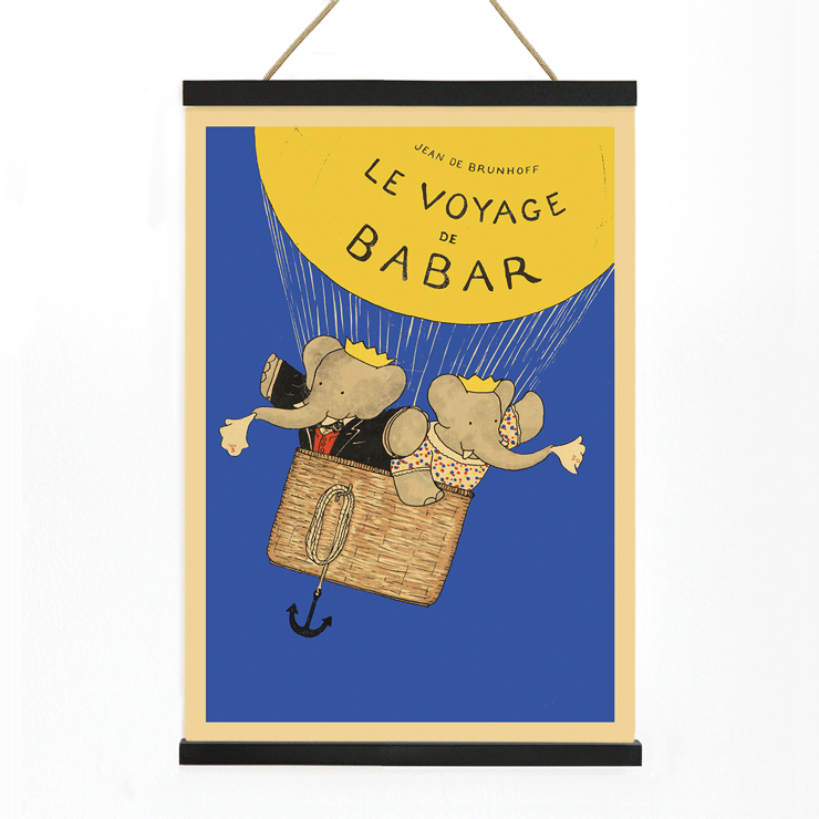 Poster of Le Voyage de Babar by Jean de Brunhoff featuring elephants in a basket under a yellow balloon on a blue background.