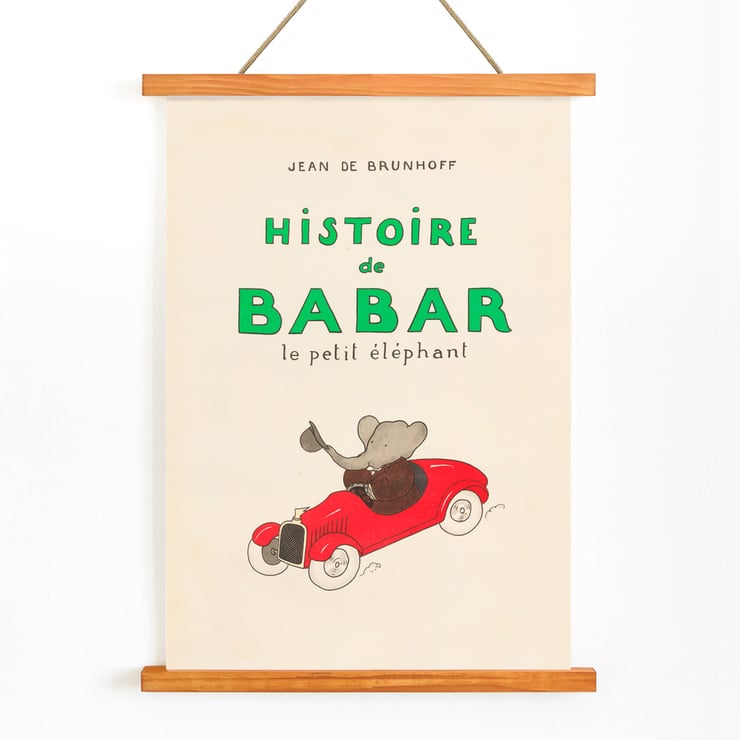 Cover illustration of Babar driving a red car from Babar en Voiture by Jean de Brunhoff. Poster of Babar en Voiture by Jean de Brunhoff featuring an elephant driving a red car with the text Histoire de Babar.