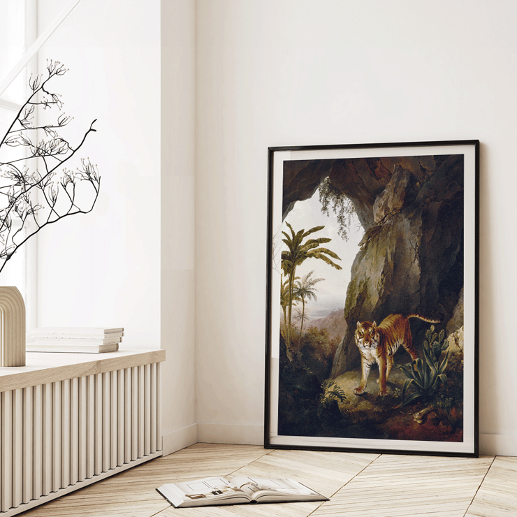 Tiger standing in cave entrance surrounded by lush vegetation by Jacques-Laurent Agasse Tiger in a Cave Poster of a painting titled Tiger in a Cave by Jacques–Laurent Agasse depicting a tiger standing in a cave with lush vegetation around.