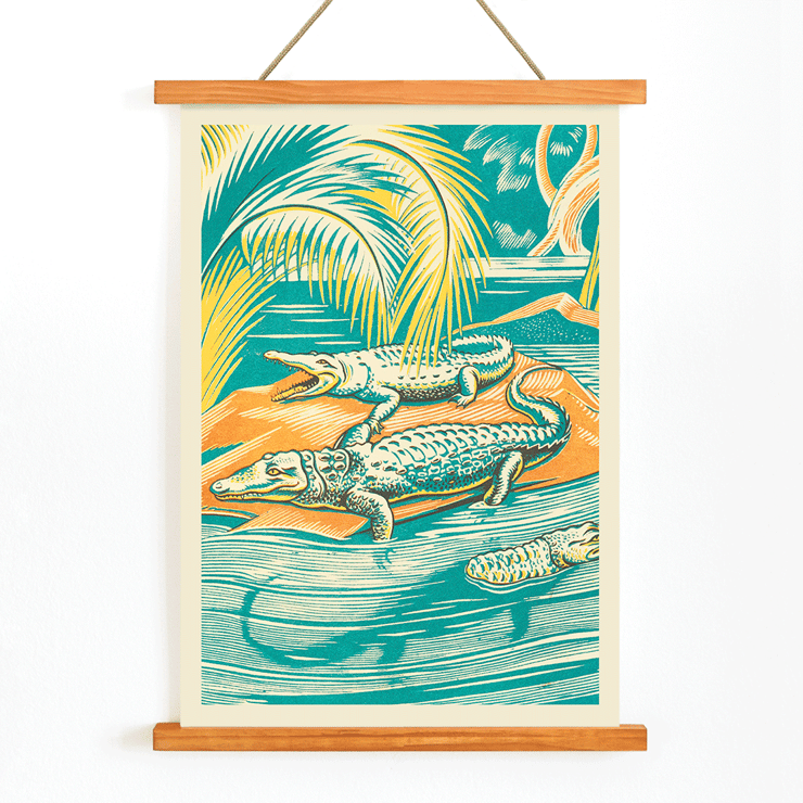Clifford Webb artwork titled A Jungle Picnic Pl.03 Crocodile depicting crocodiles in a vibrant jungle setting Poster depicting crocodiles resting by a river under palm trees, artwork title A Jungle Picnic Pl.03 Crocodile by Clifford Webb