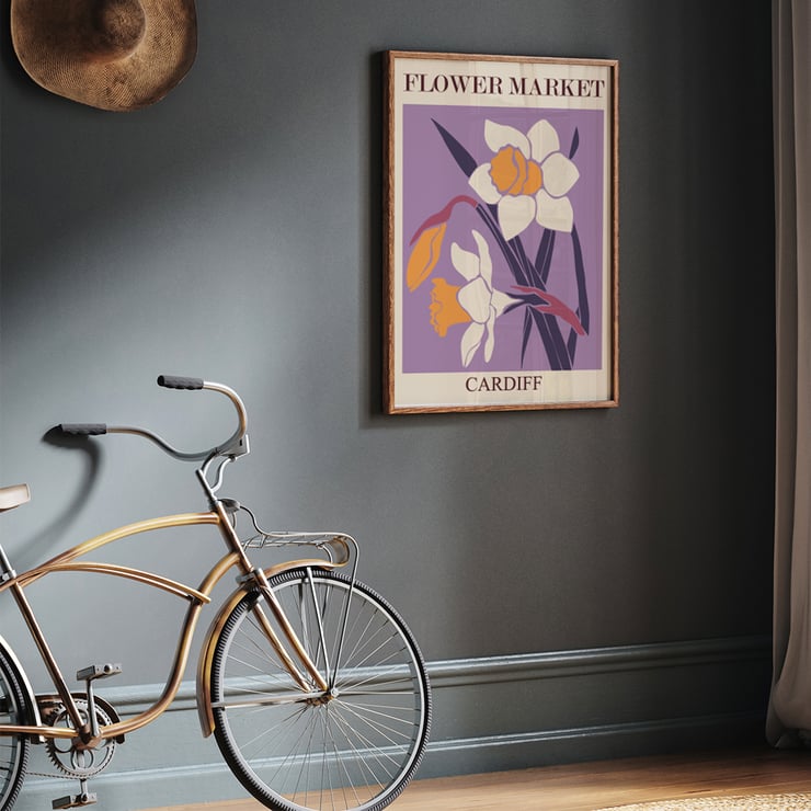 Illustration of yellow and white flowers by the artist Moryarty titled Flower Market - Cardiff Poster titled Flower Market - Cardiff by Moryarty featuring illustrated daffodils on a purple background.
