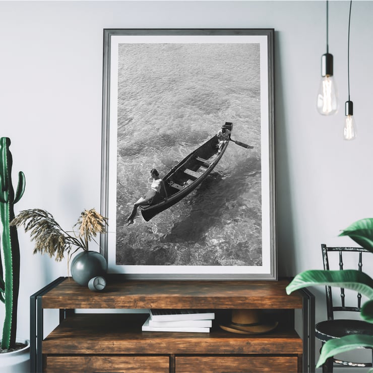 Fashion model on edge of boat Fashion model on edge of boat
