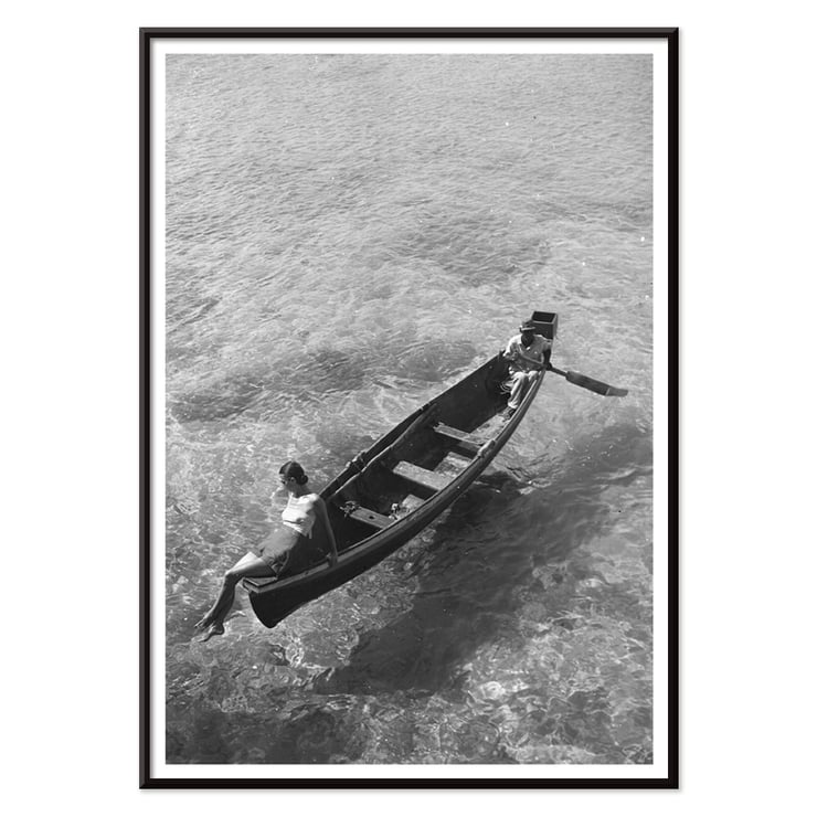 Fashion model on edge of boat Fashion model on edge of boat