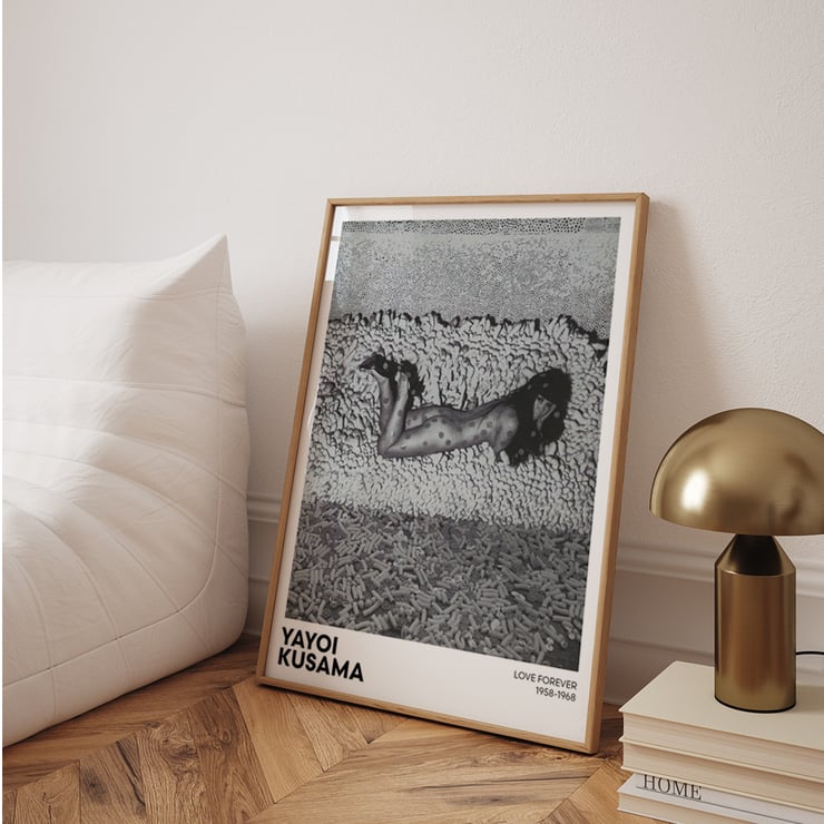 Yayoi Kusama Love Forever black and white artwork featuring a dotted figure on a textured background Poster of Yayoi Kusama's artwork featuring a black and white image of a woman with polka dots surrounded by textured shapes.