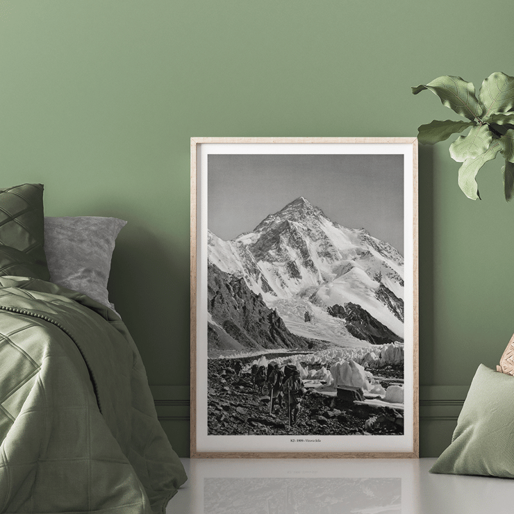 Glacier expedition near K2 by Vittorio Sella Le pic K2 vue prise du glacier Godwin-Austen Poster showing mountaineers trekking toward K2 over a rocky glacier field in black and white by Vittorio Sella titled Le pic K2 vue prise du glacier Godwin-Austen
