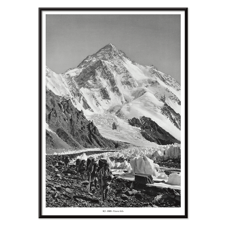Glacier expedition near K2 by Vittorio Sella Le pic K2 vue prise du glacier Godwin-Austen Poster showing mountaineers trekking toward K2 over a rocky glacier field in black and white by Vittorio Sella titled Le pic K2 vue prise du glacier Godwin-Austen