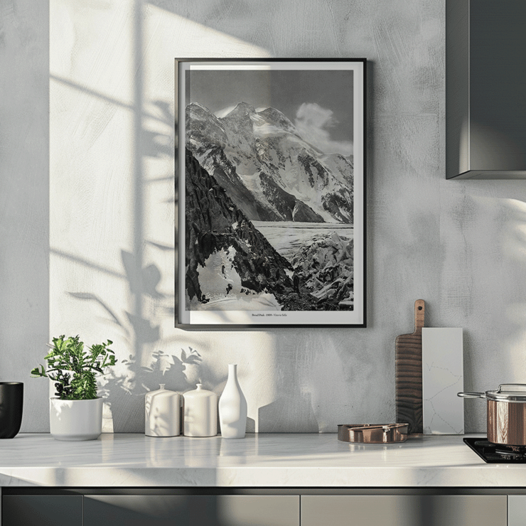 Black and white photograph of Broad Peak by Vittorio Sella featuring snow-covered mountains and climbers in the foreground Poster of snowy Broad Peak mountain captured by Vittorio Sella with mountaineers climbing amidst rocky terrain and glacier