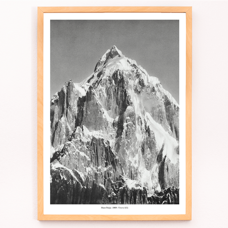 Mount Paitju towering with snow and rugged terrain photo by Vittorio Sella. Poster of Le mont Paitju, vue prise du Baltoro by Vittorio Sella showing a towering snow-covered mountain.