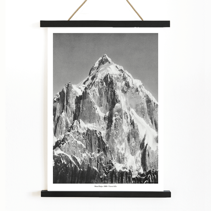 Mount Paitju towering with snow and rugged terrain photo by Vittorio Sella. Poster of Le mont Paitju, vue prise du Baltoro by Vittorio Sella showing a towering snow-covered mountain.