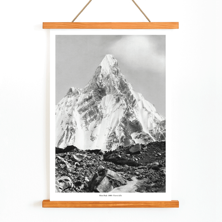 Photograph of Mitre Peak surrounded by rocky terrain by Vittorio Sella Poster of Mitre Peak vu du glacier du Baltoro by Vittorio Sella depicting a towering snowy peak against a rocky foreground.