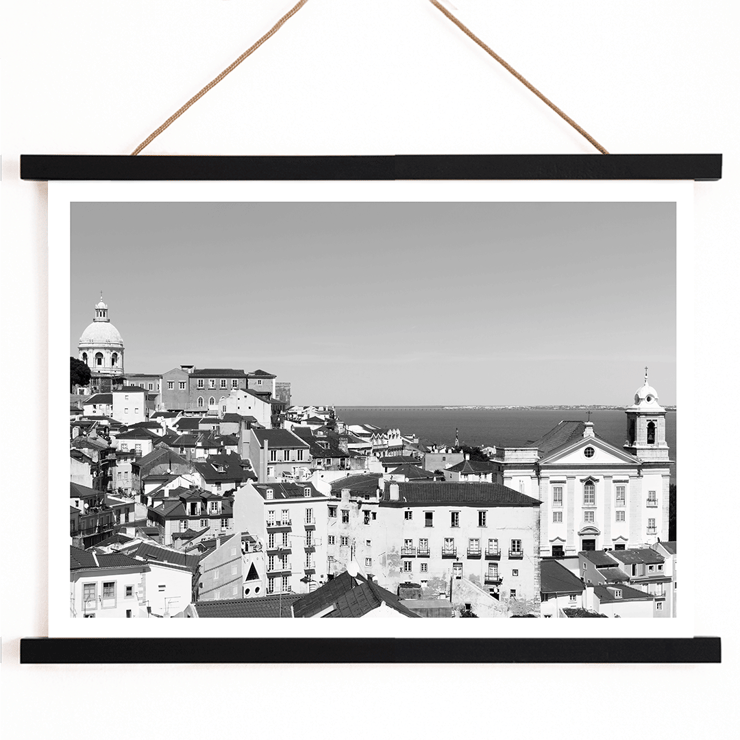 Lisbon Old City landscape black and white by Picture 2 featuring historic architecture and distant sea view Poster featuring a black and white landscape of Lisbon's old city with rooftops and historic buildings titled Lisbon Old City Landscape