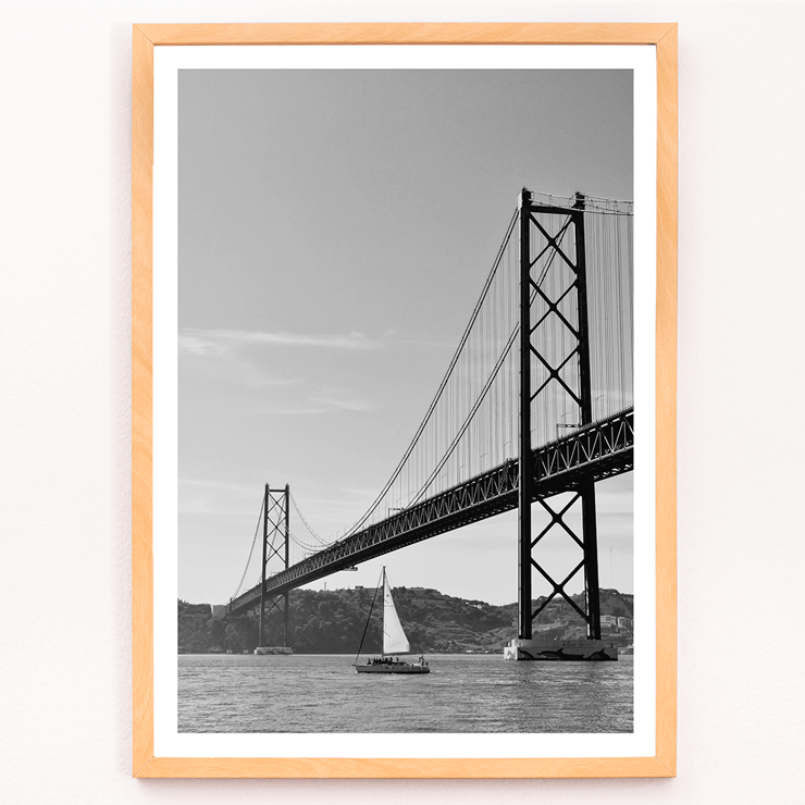 Lisbon Bridge Black and White Picture featuring by Raphael Alves Poster featuring Lisbon Bridge Black & White Picture with a framed photograph of a suspension bridge and a sailboat in the water