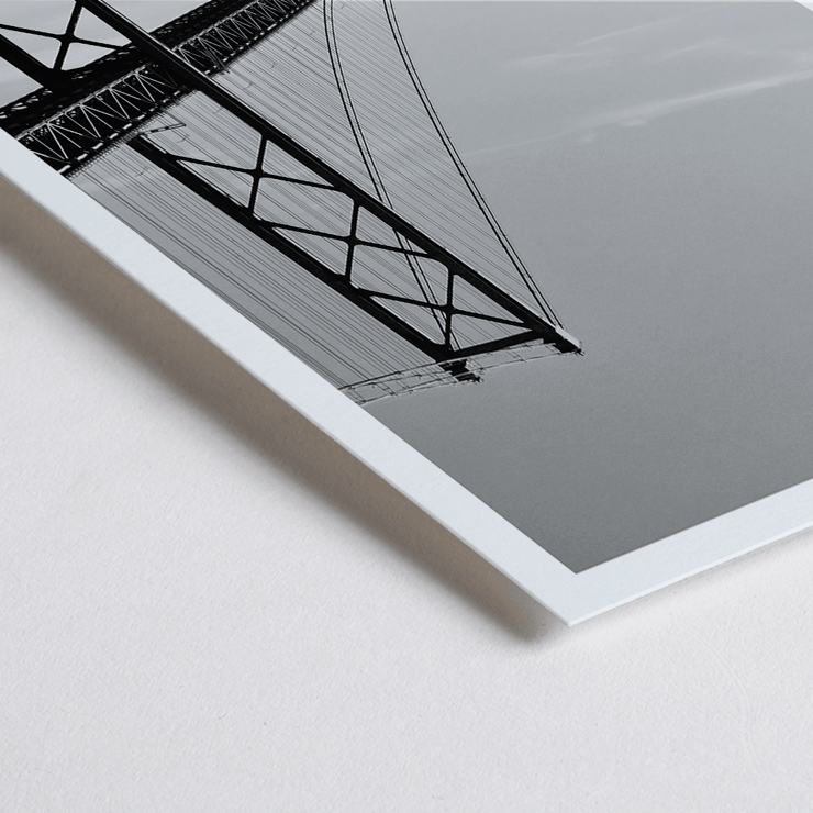 Lisbon Bridge Black and White Picture featuring by Raphael Alves Poster featuring Lisbon Bridge Black & White Picture with a framed photograph of a suspension bridge and a sailboat in the water