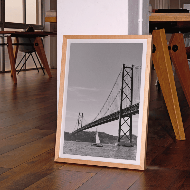 Lisbon Bridge Black and White Picture featuring by Raphael Alves Poster featuring Lisbon Bridge Black & White Picture with a framed photograph of a suspension bridge and a sailboat in the water