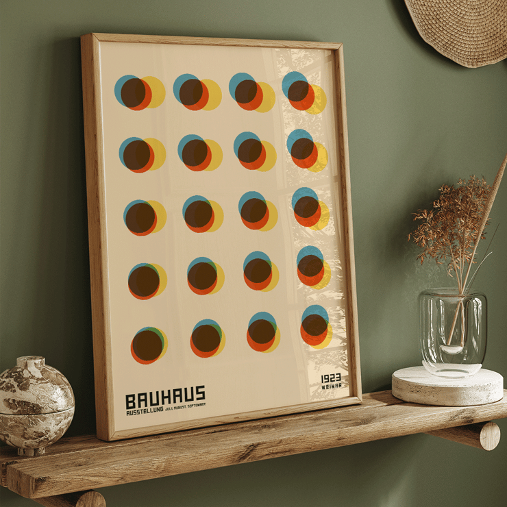 Bauhaus Poster 7 Inspired by the 1923 Weimar Exhibition features colorful overlapping circles in a geometric design. Bauhaus Poster 7 Inspired by the Weimar Exhibition features geometric overlapping circles in blue red yellow and brown tones.