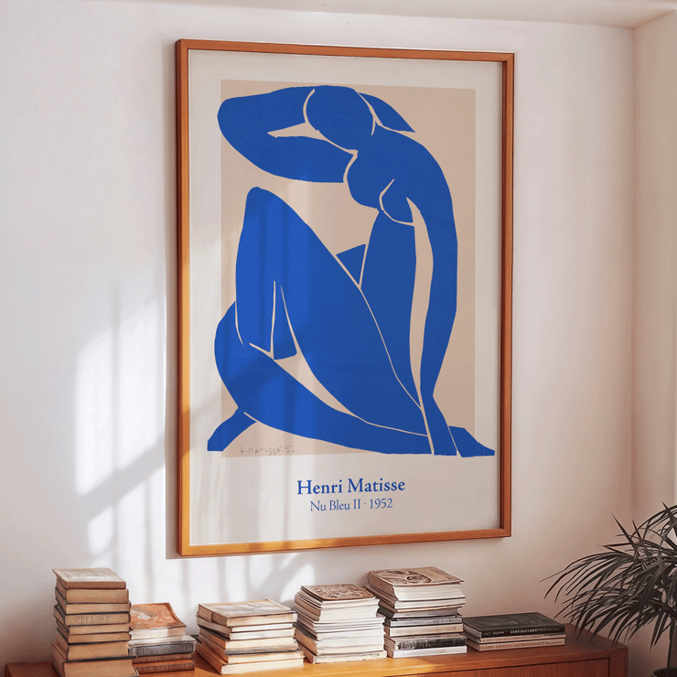 Nu Bleu II by Henri Matisse abstract blue figure art print framed Poster featuring the artwork Nu Bleu II by Henri Matisse with a blue abstract figure on a beige background.